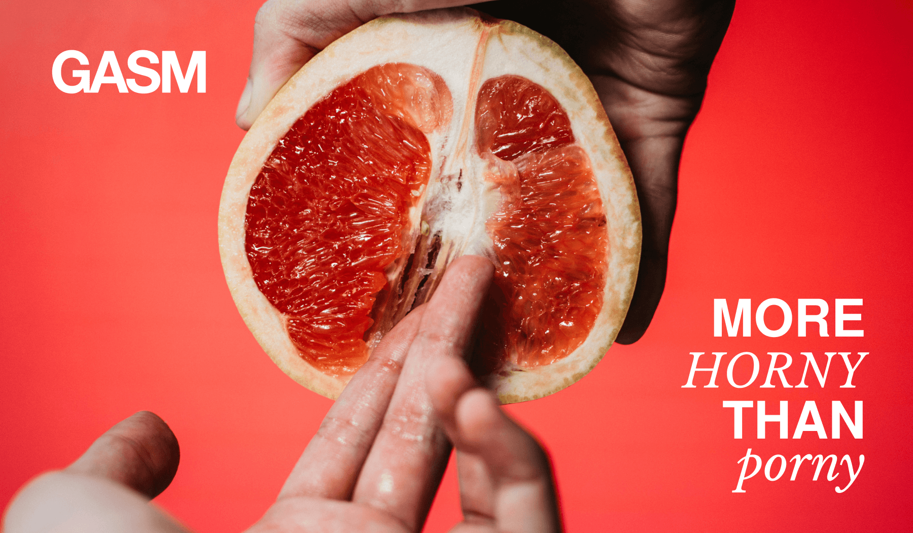 A bright red background shows the half cut of an open grapefruit being held at the top by a dark hand with two fingers in the middle of the grapefruit and the text More horny than porny