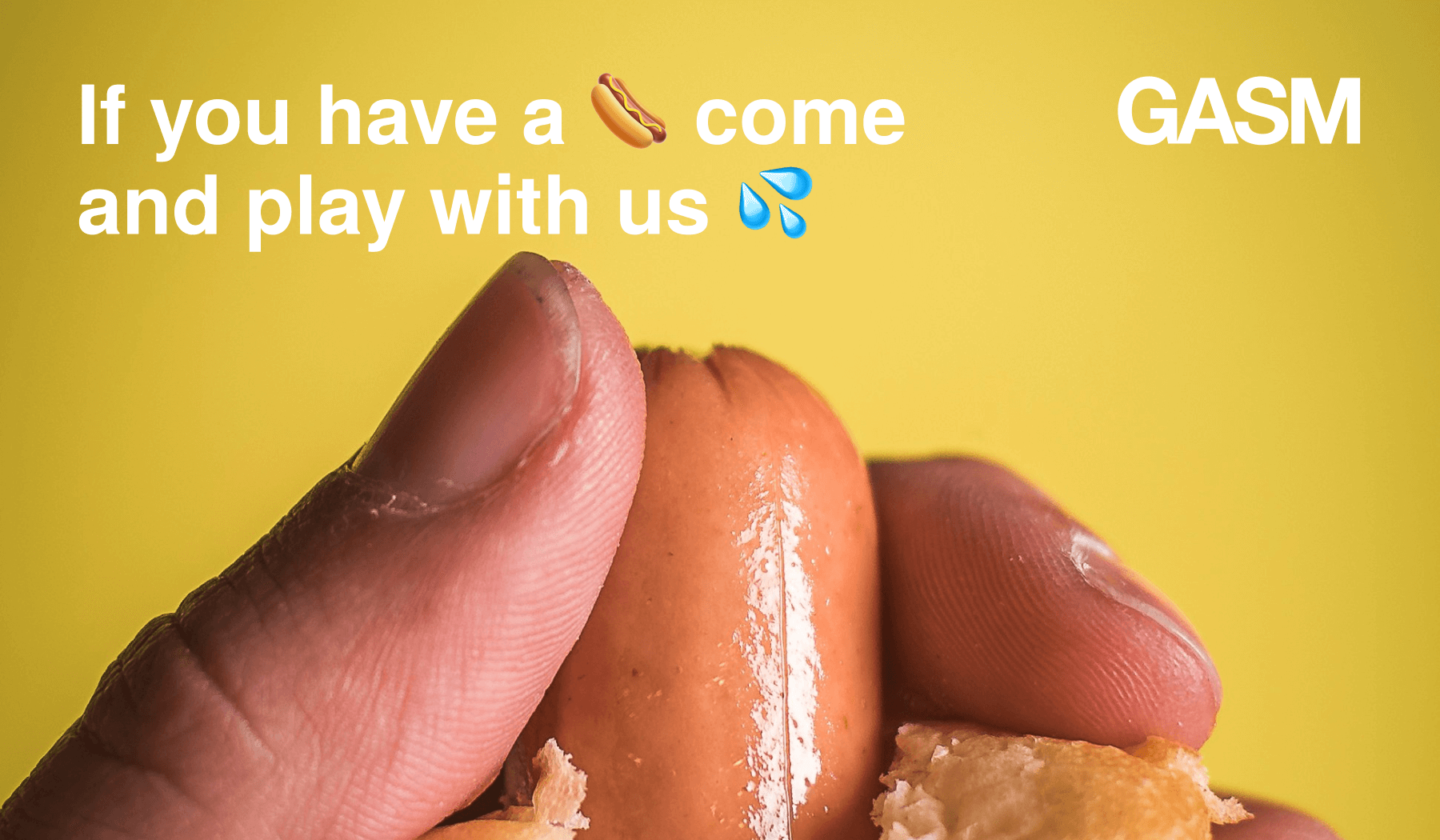 A bright yellow image background with the camera zoomed in on the sausage sticking out of the end of a hotdog being held by a thumb and index finger, with the text If you a (sausage emoji) come an play with us (water drops emoji)