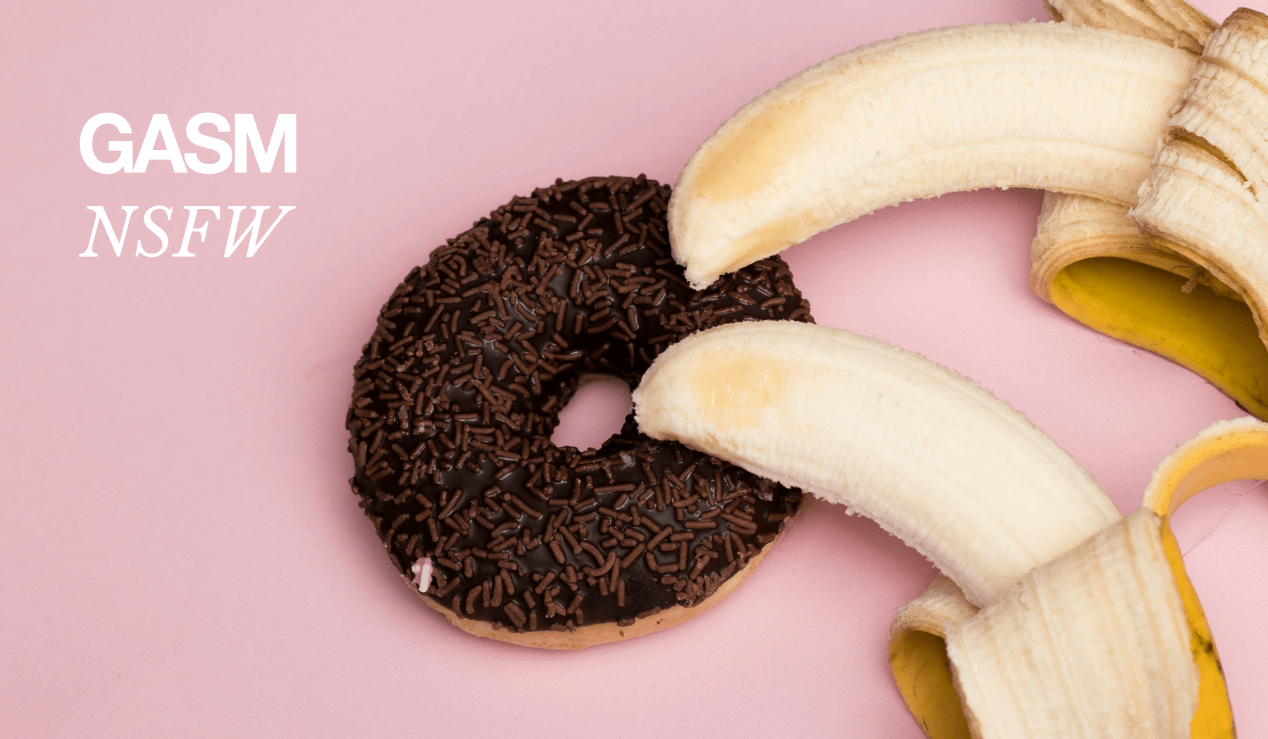 A bright pink background shows a chocolate sprinkle covered donut with two bananas laying half unpeeled on top facing toward the hole with the text GASM NSFW meaning GASM is not safe for work in a cheeky way